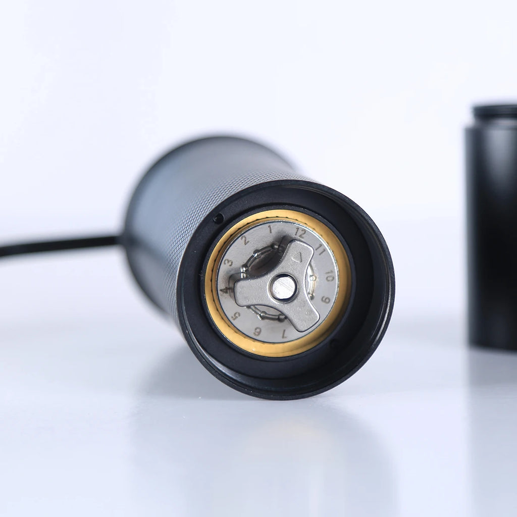 Close-up of a coffee grinder on a white background