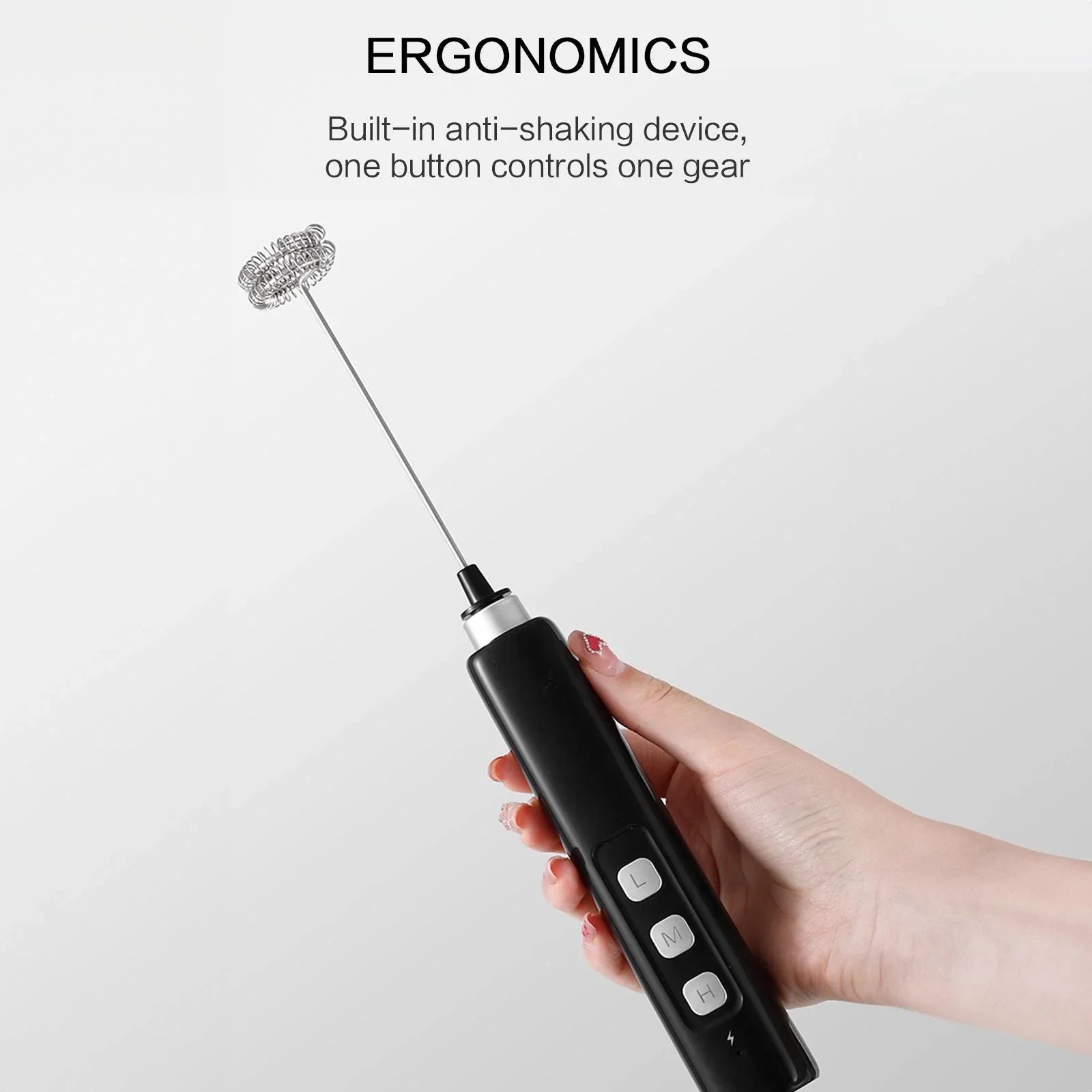 Hand holding a black milk frother with text about ergonomics on a light gray background