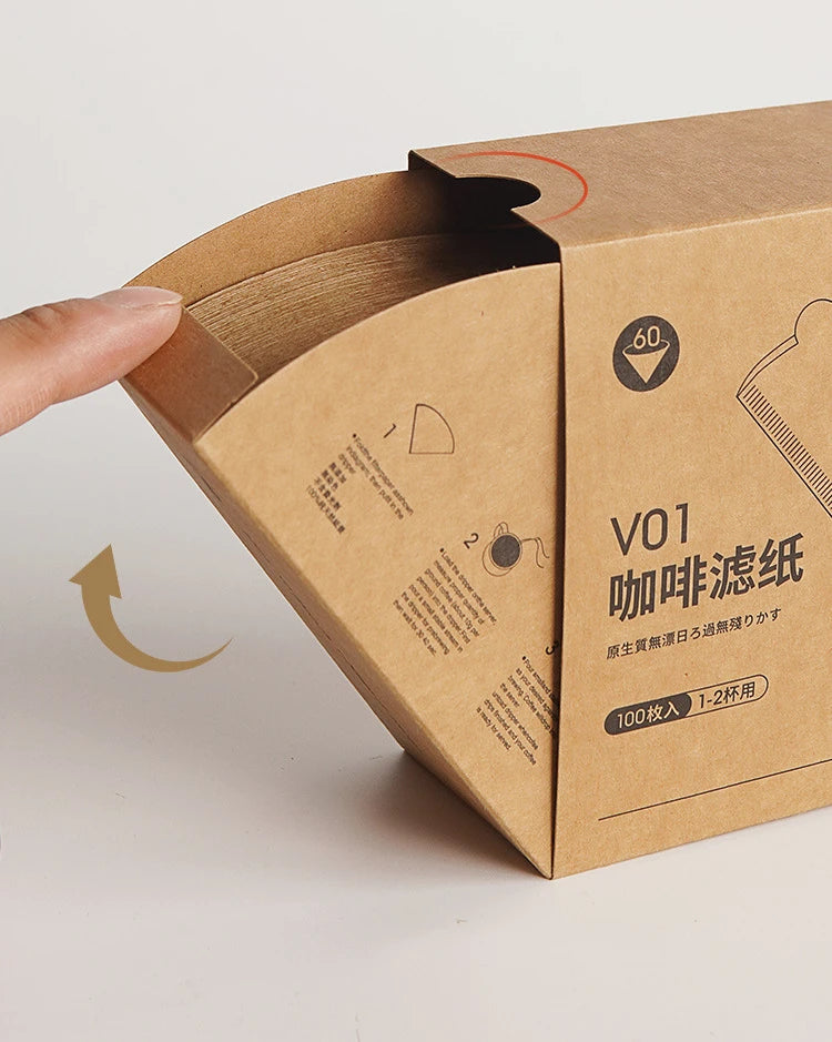 Brown paper box with coffee filter packaging on a light gray background