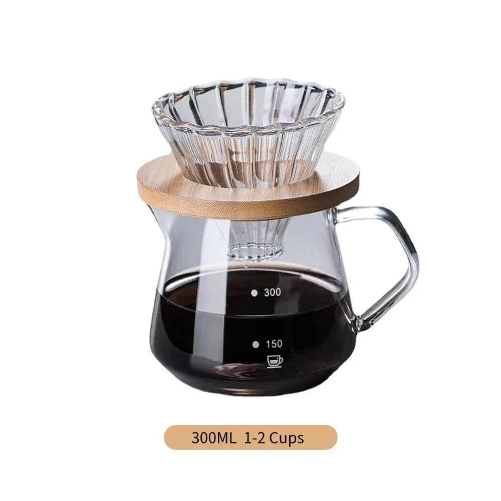 Clear glass coffee maker with wooden collar and handle on a white background