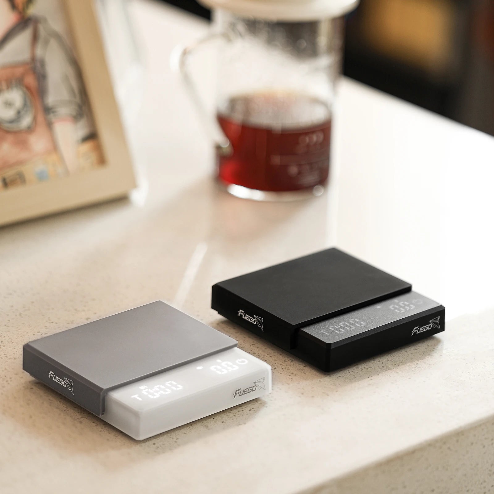 Two electronic devices labeled 'Fuzion' on a surface with a blurred background