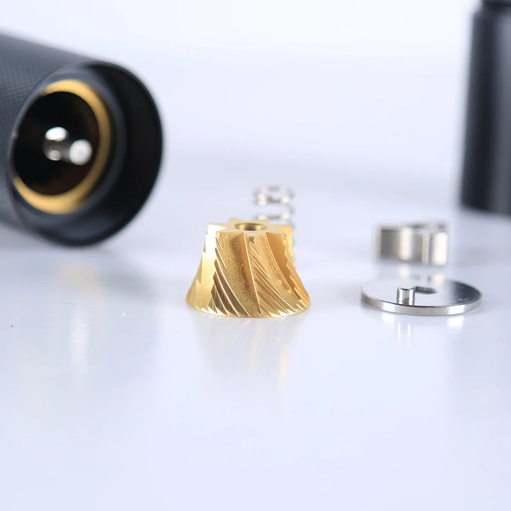 Gold and silver metallic components on a white background