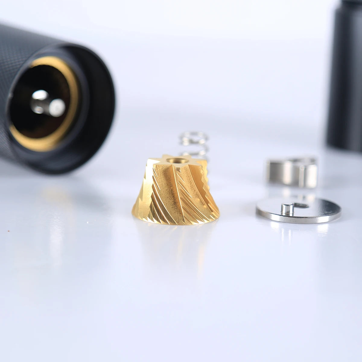 Gold and silver metallic components on a white background