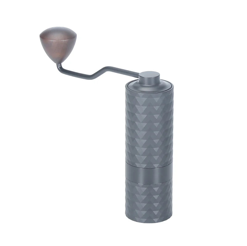 Gray manual coffee grinder with geometric pattern on a white background