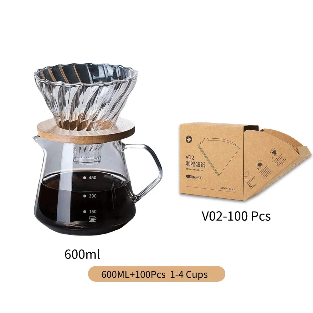 Coffee brewing set with glass carafe, wooden collar, and filter, accompanied by a box of filters on a white background.